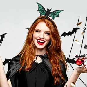 Close-up detail of Halloween bat headband with green glitter wings, perfect for costume party.