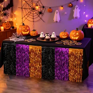 Halloween black purple orange foil fringe table skirt detail view for party table decor.