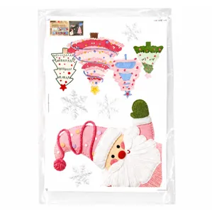Detailed view of Christmas DIY felt decoration set with cute Santa Claus and colorful trees.