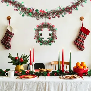 Christmas tinsel garland scene detail, festive red silver green hanging party decoration.