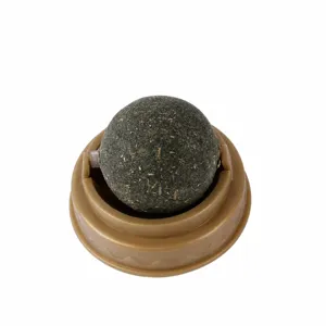 Rotating catnip ball toy for cats, interactive pet teeth cleaning chew toy with base.