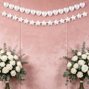 White heart star pearl string hanging decoration detail for wedding birthday party backdrop setup.
