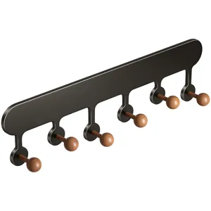 Mid-century wall mounted coat rack with 6 wooden ball hooks for entry room and door storage.
