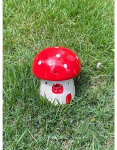 Charming ceramic mushroom night light detail showing cute red and white polka dot cap design.