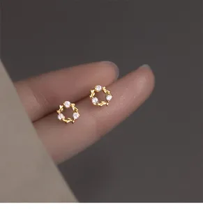 Delicate S925 silver wreath diamond stud earrings, minimalist detail showing fine craftsmanship.