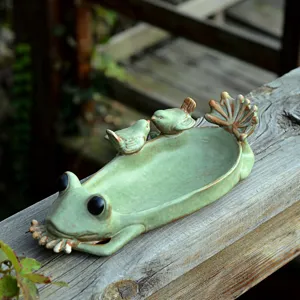 Ceramic frog tray detail, cute animal shape decor, handmade art sculpture display.