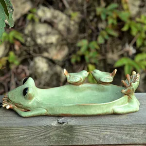 Green ceramic frog tray with cute little birds decoration, perfect for home desktop decor.