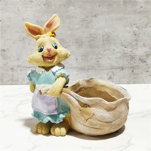 Close-up detail of cute rabbit figurine succulent planter for garden yard decoration.