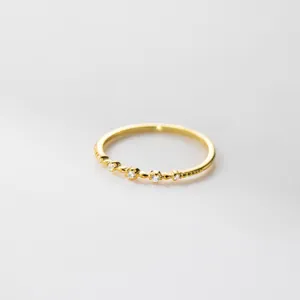 Close-up detail of delicate S925 sterling silver micro-pave zirconia thin stackable ring.