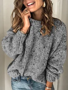 Detailed view of the cozy gray speckled knit sweater, featuring crew neck and long sleeves.