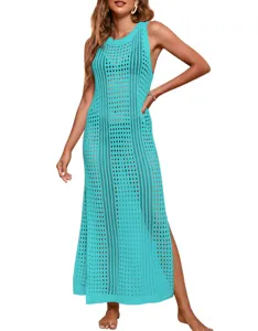 Close-up detail of the turquoise crochet knit maxi beach cover-up, hollow-out summer style.