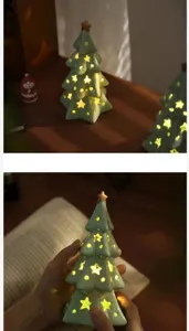 Ceramic Christmas tree night light with star cutouts, cozy table decor and ambient lamp.