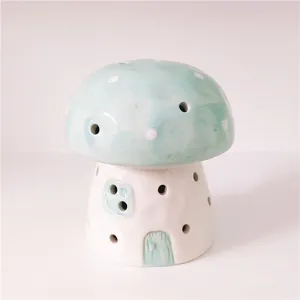 Ceramic mushroom night light detail shot, cute pastel green accent, warm ambient bedroom decor.