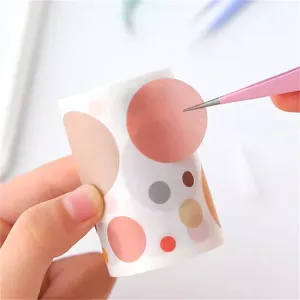 Precision craft tweezers and sticker detail showing fine point tips for handmade DIY projects.