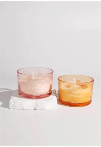 Detailed close-up view of colorful glass scented candles, Nordic home aroma crystal decor.