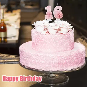 Pink birthday number candle with cute pink bow decoration for party cake celebration.