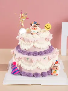 Cute smiley face candle two-tier birthday cake decoration set for children's party celebration.