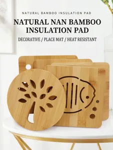 Natural bamboo insulation mat detail shot showing hollow carved tree and fish patterns.