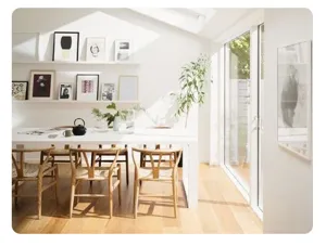Detailed view of heat insulation mat in bright minimalist dining room setup with wooden chairs.