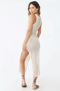 Detail shot of beige knit crochet beach cover-up dress with high side slit for summer.