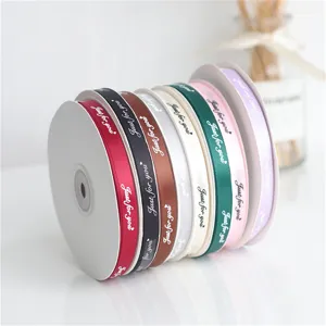 Close-up detail of colorful fabric ribbons featuring printed Just for you text lettering.