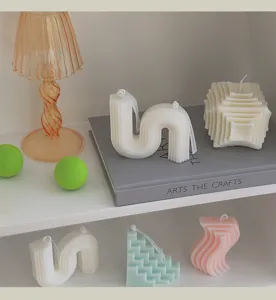 Niche geometric scented soy wax candles, unique abstract shapes for home decor and gifts.