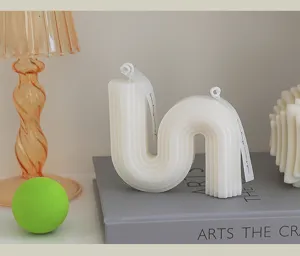 Minimalist geometric wavy scented soy wax candle for home decor and cozy gift styling.