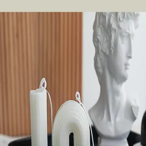 Aesthetic scented soy wax candles with unique geometric pillar and arch design for home decor.