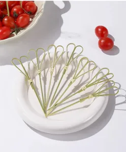 Close up of heart shaped bamboo fruit skewer, ideal for party decor and dessert display.
