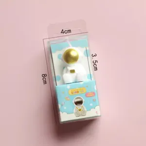 Cute astronaut shape birthday candle in clear box, perfect for kids party cake decoration.