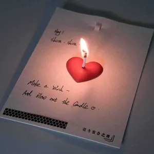 Detail view of a romantic 3d heart candle greeting card with custom text, perfect for couples.