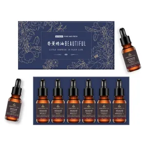 Essential oil set detail showing 6 bottles of 10ml aromatherapy oils with elegant gift box.