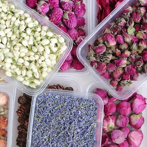 Close-up detail of assorted dried flower buds and lavender for DIY candle making.