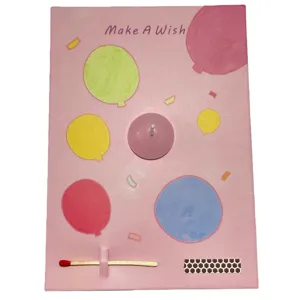 Creative greeting card with candle and match design, pink balloon pattern for celebration.