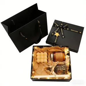 Coffret cadeau de bougies parfumées de luxe avec bougie bulle et bâtonnets de diffusion.