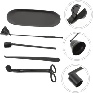 Black aromatherapy candle tool set including tray, bell snuffer, wick dipper and trimmer.