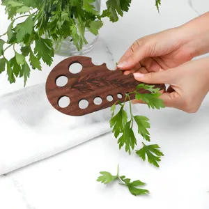 Wooden herb stripper tool for easily removing leaves from parsley, cilantro and stems.