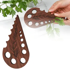 Wooden herb stripper tool with multi-hole design for easily removing leaves from fresh greens.