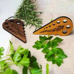 Wooden herb stripper multi-hole leaf remover tool for fresh rosemary and parsley kitchen.