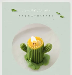 Detailed shot of a green cactus shaped scented soy wax candle burning with a clear wick.