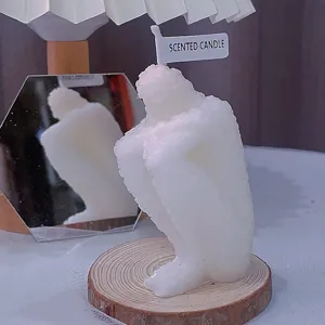 Detail view of the unique hugging figure scented candle, creative home decor ornament piece.