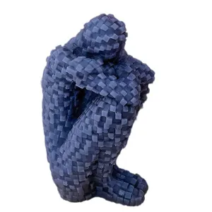 Pixel mosaic hugging figure scented candle, creative lonely man sculpture for home decor.