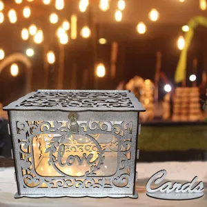 Wooden wedding card box detail showing silver glitter hollow design with love text and lights.