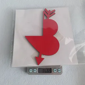 Valentine's day wooden door corner decoration detail view, red arrow heart shape sticker.