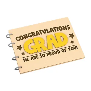 Wood graduation photo album cover detail with laser engraved congratulatory text and stars.