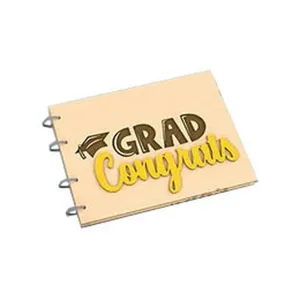 Wooden graduation photo album cover detail with metallic binding rings and engraved text.