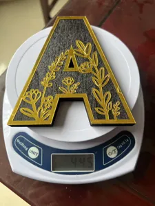 Wooden letter A decor detail view, showing carved floral pattern and weight, perfect desktop ornament.
