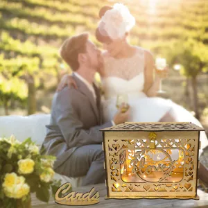 Rustic wooden wedding card box with hollow heart design and warm lights for party reception.