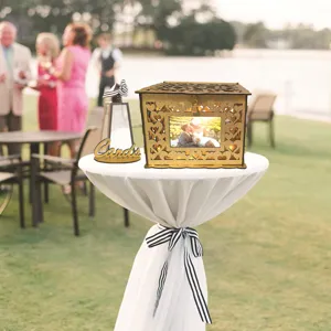 Wooden hollow wedding card box detail scene with heart patterns and photo display slot.