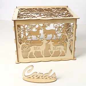 Wooden wedding card box with hollow deer design and rustic cards sign for reception.